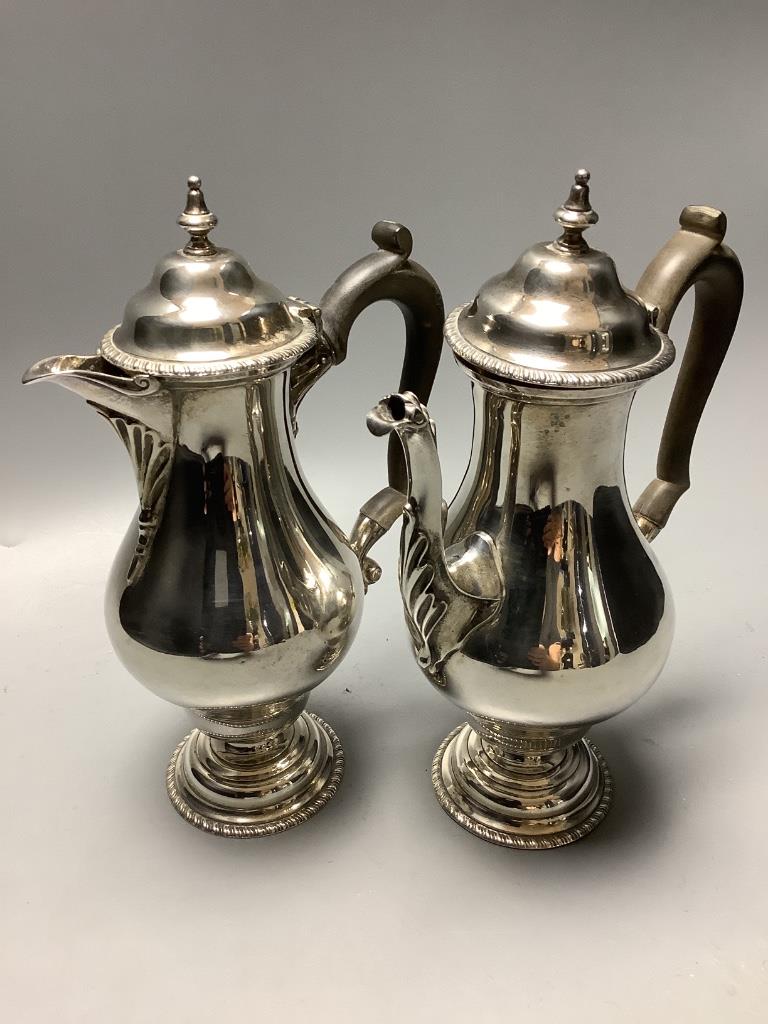 A George V silver café au lait pair of balluster form, Daniel and John Welby, London, 1912, height 21.4 cm, weighted